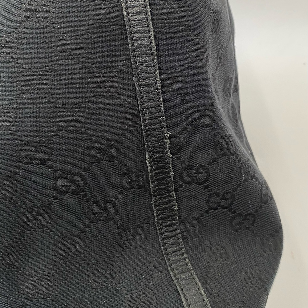 Gucci Black GG Canvas Drawstring Backpack with Gold Accent - Picture 10 of 14